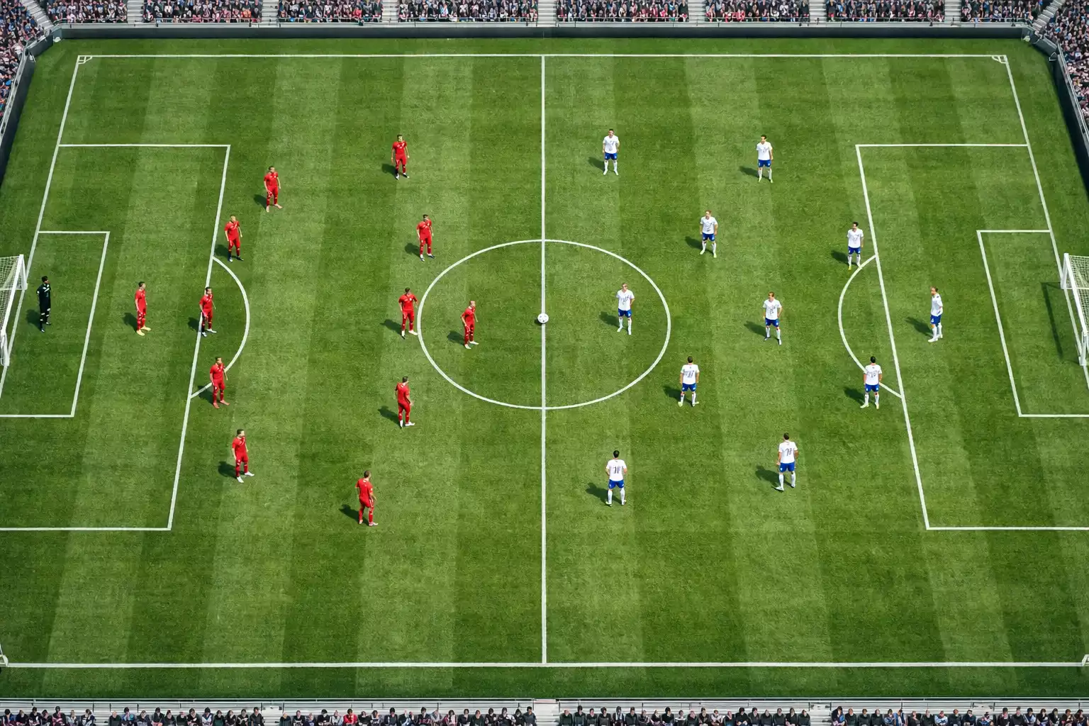 Vue plongeante sur un terrain de football avec les deux équipes en formation tactique